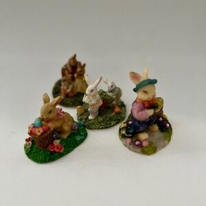 SET OF 4 RESIN EASTER RABBITS IN THEIR GARDENS